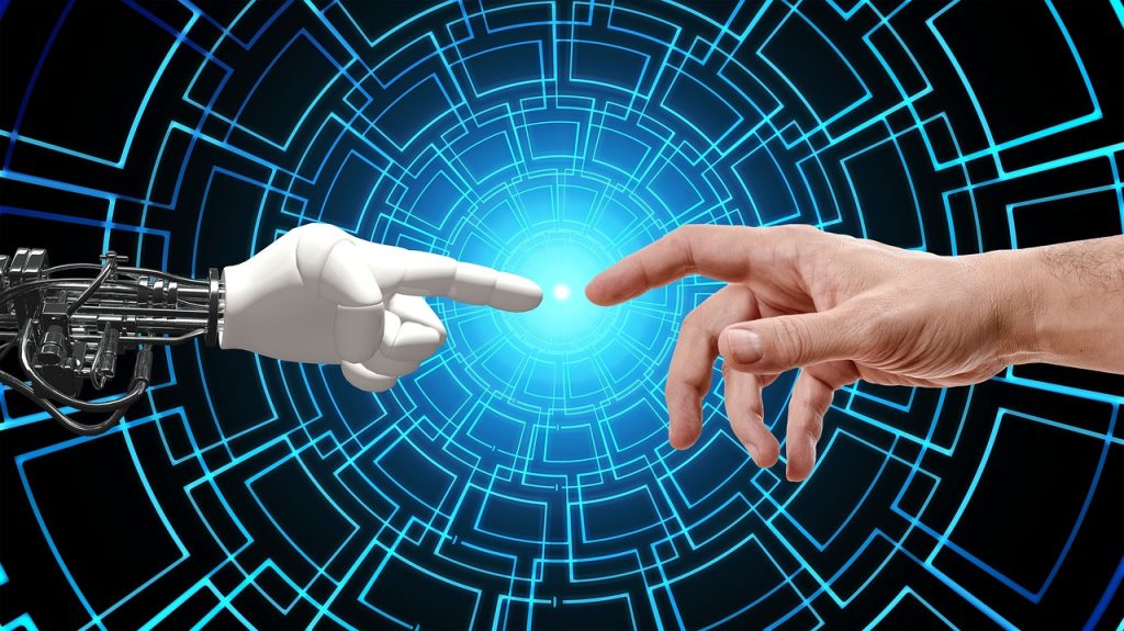 mano umana che tocca la mano di un robot che simbolizza la sinergia tra Intelligenza Artificiale e psicologia